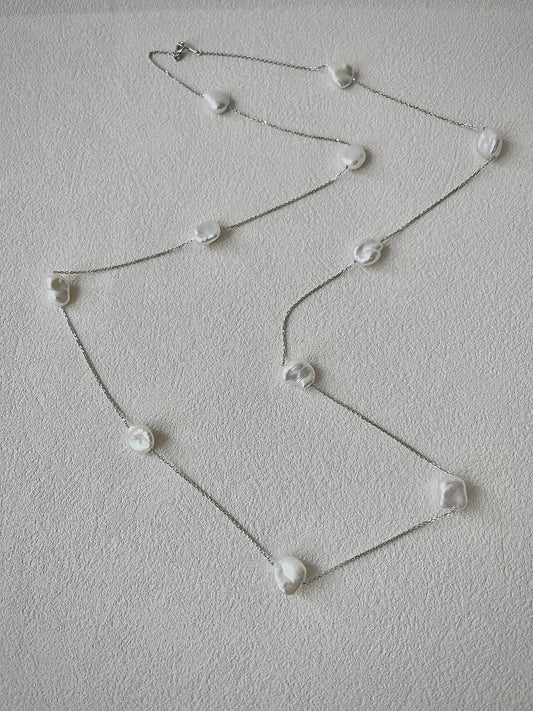 keshi Pearl necklace on a light gray background