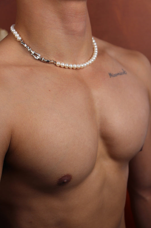 Men wearing a shining white pearl strand necklace
