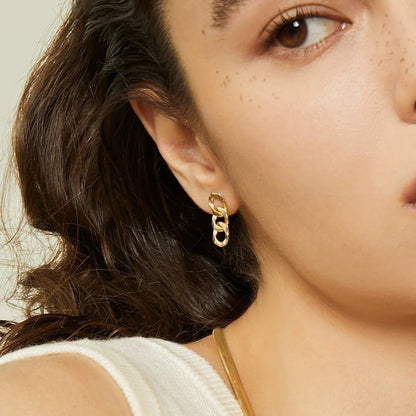 18k Gold Earrings worn by a model, featuring stylish chain design that sparkles elegantly.