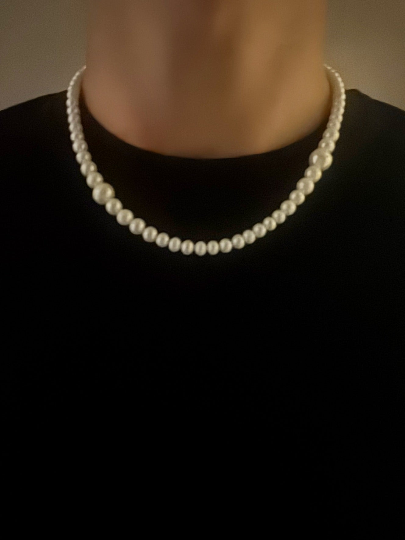Pearl necklace on a black background