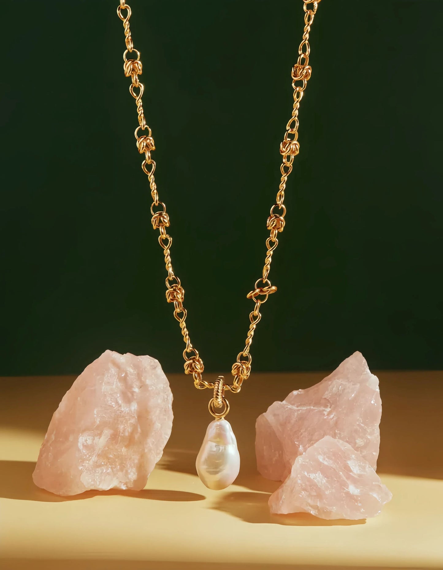 BOLD Golden Aurora baroque pearl pendant necklace on a gold chain with pink quartz rocks.