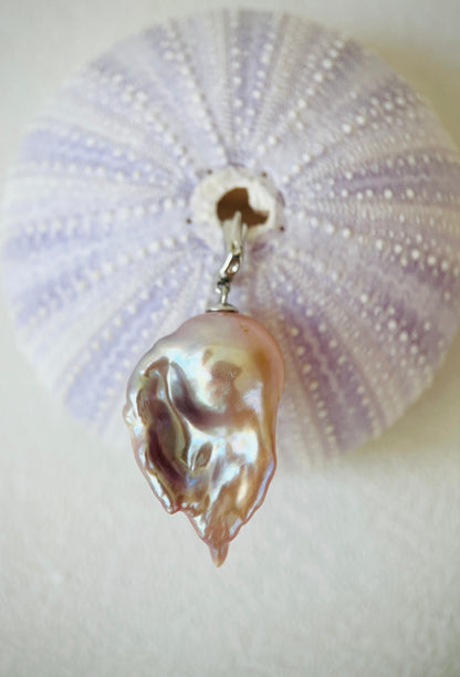 Pearl pendant on a white background