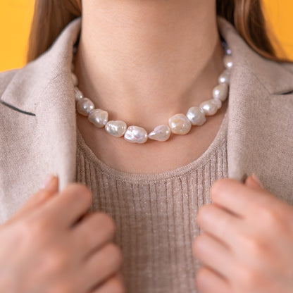Baroque Pearl Necklace - BOLD - Reinvent White Pearl Strand worn by a model, showcasing organic elegance with 24K Gold Vermeil detailing.