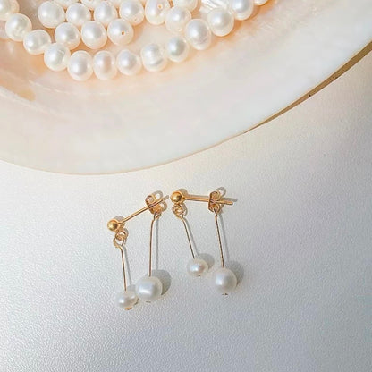 Pearl earrings on a light background