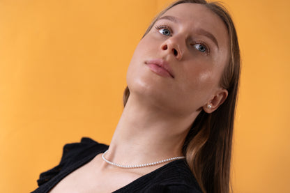 white Pearl necklace on a model