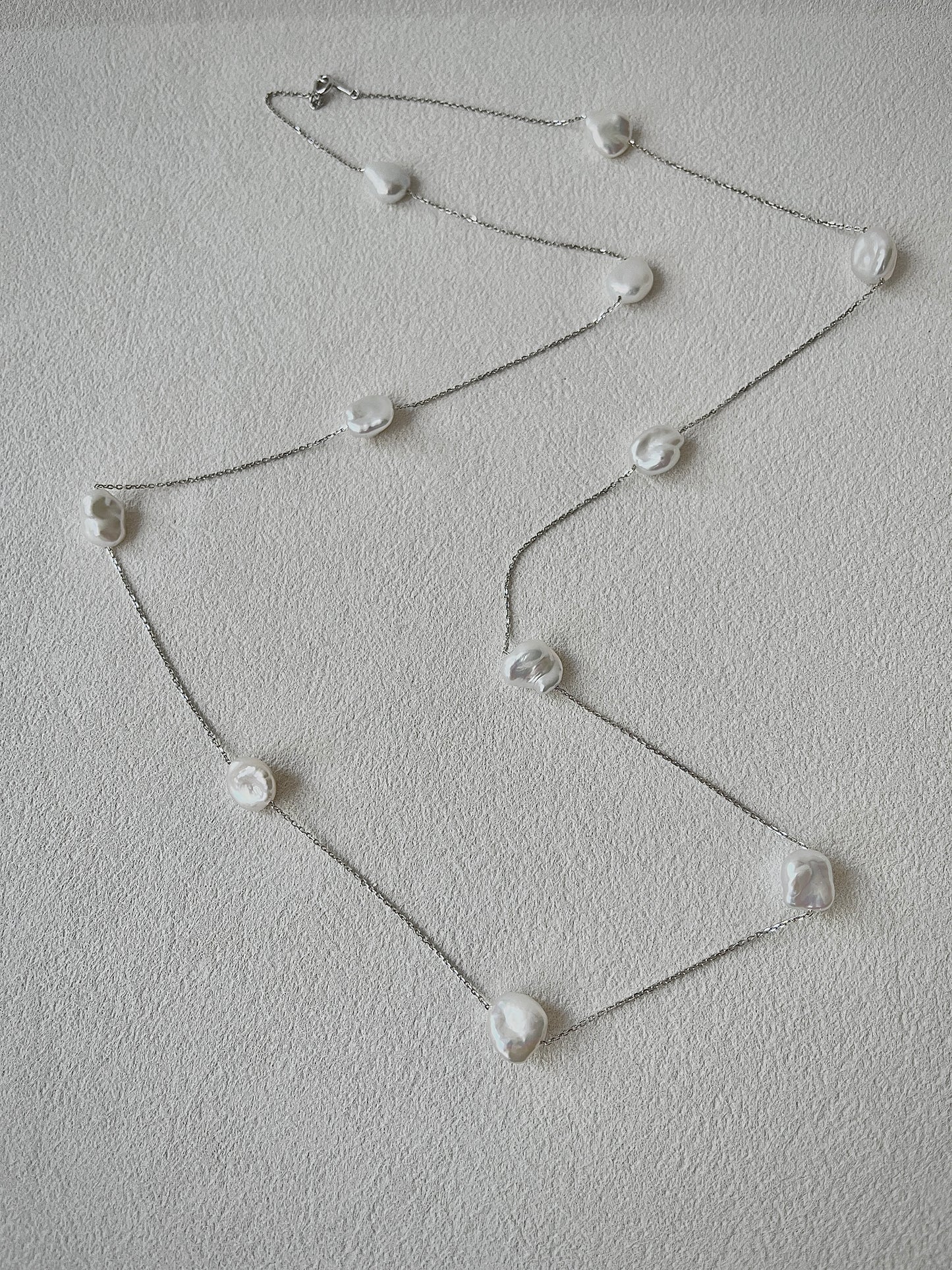 keshi Pearl necklace on a light gray background