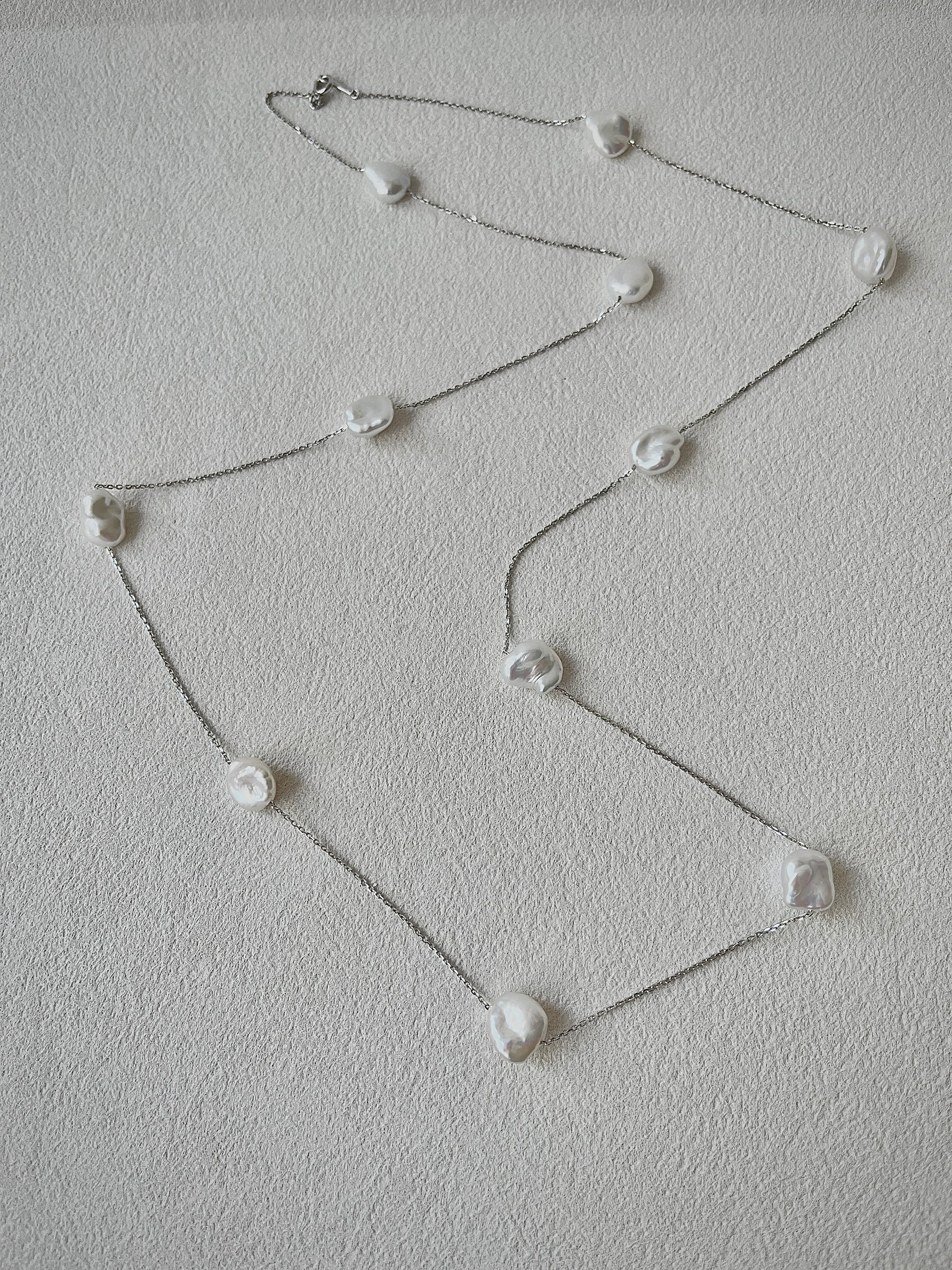 keshi Pearl necklace on a light gray background
