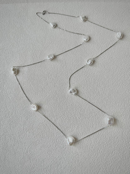 keshi Pearl necklace on a light gray background