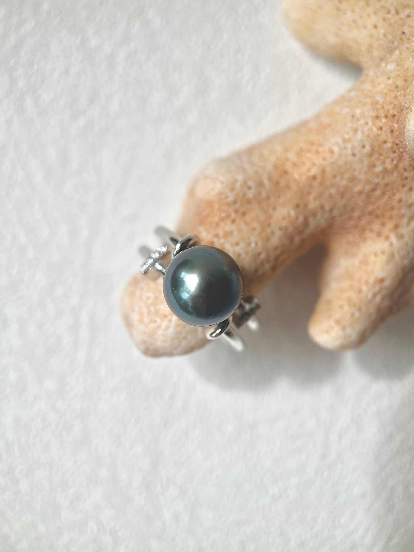 Tahitian Pearl ring on a textured beige surface