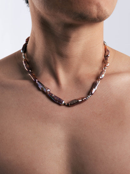 Pearl Necklace worn by a person on a plain background