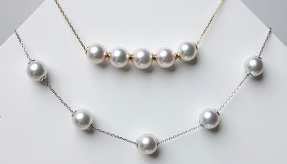 Adjustable freshwater pearl necklace with premium round pearls on 18K solid gold and silver chains.