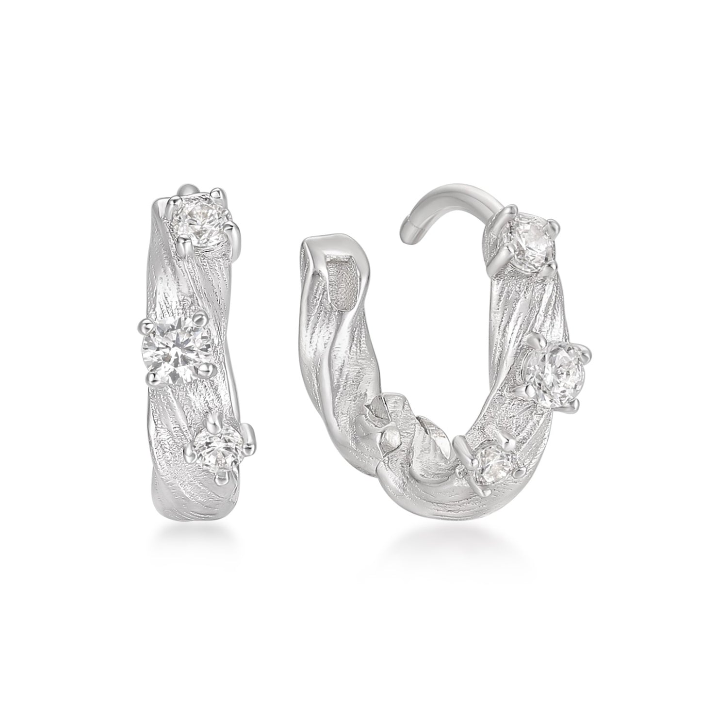 Silver hoop earrings with zircon accents on a white background