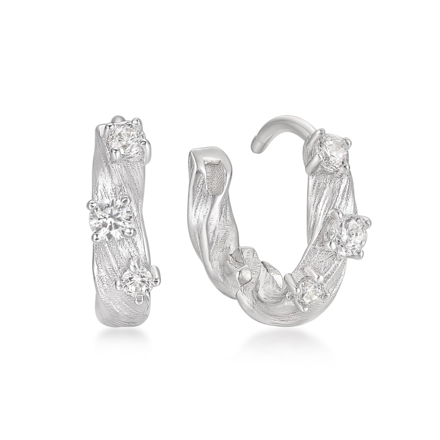 Silver hoop earrings with zircon accents on a white background