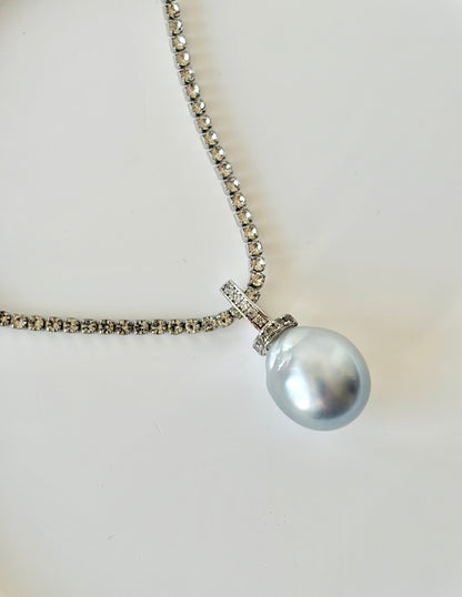 South Sea White Pearl necklace with silver chain on a light background