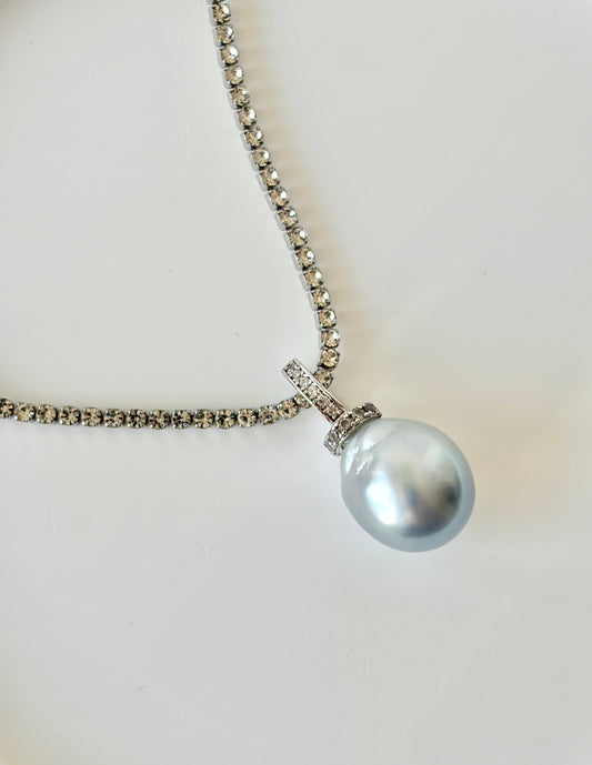 South Sea White Pearl necklace with silver chain on a light background