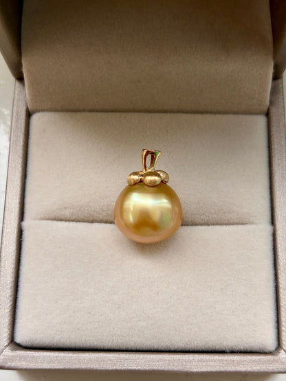South Sea golden pearl pendant in an open jewelry box.