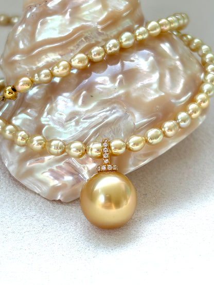 Golden pearl necklace on a shell background