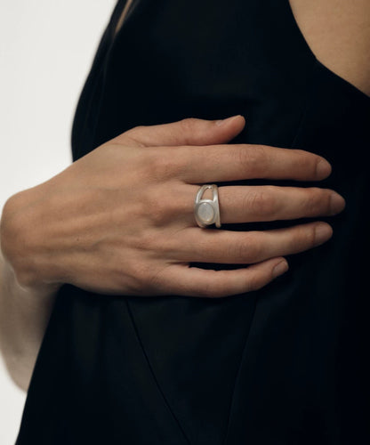 Elegant silver ring with nacre gemstone, showcasing a vintage-inspired double-layer design.