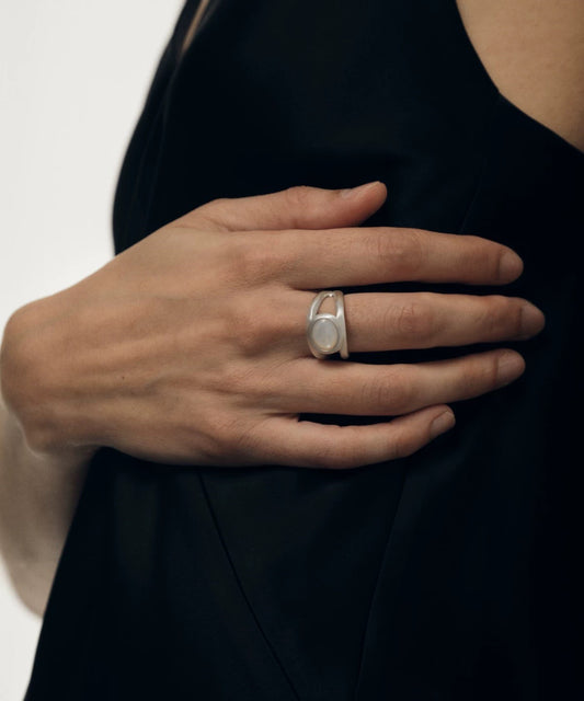 Elegant silver ring with nacre gemstone, showcasing a vintage-inspired double-layer design.