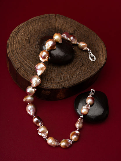 Pearl Necklace on a wooden block with a red background