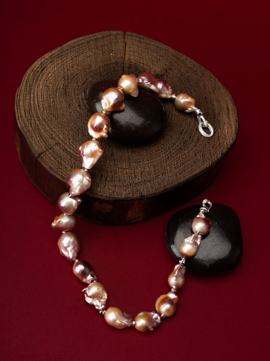Pearl Necklace on a wooden block with a red background