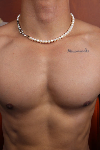 Men wearing a shining white pearl strand necklace