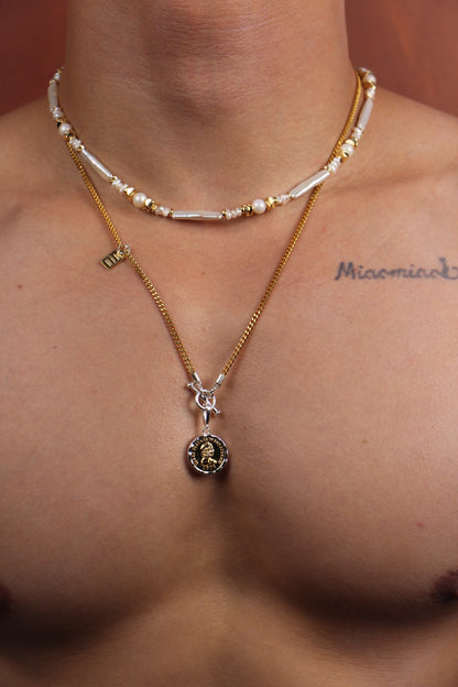 Men wearing pearl necklace with white Keshi and round pearls