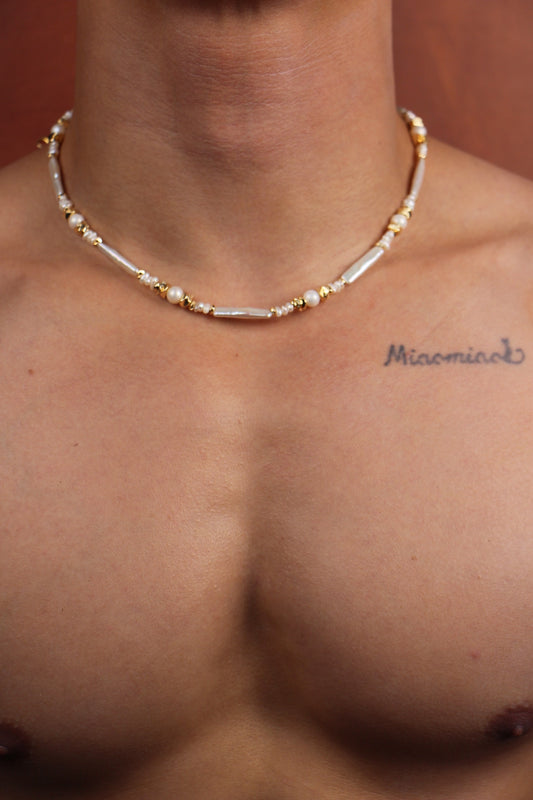 Men wearing pearl necklace with white Keshi and round pearls